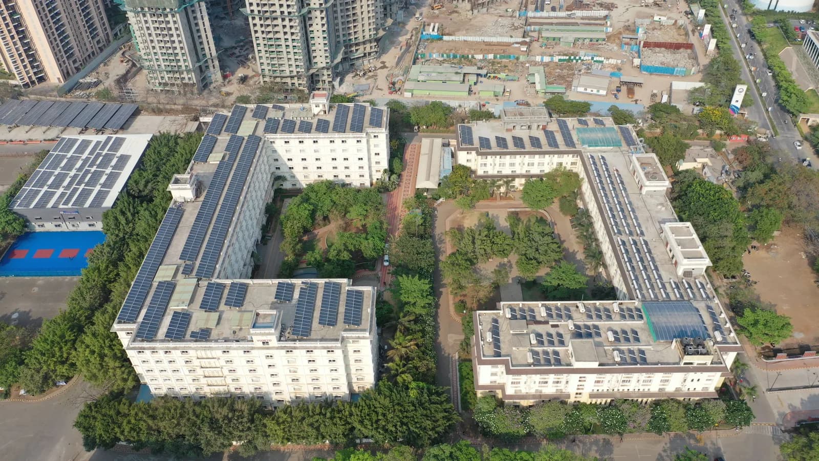 Aerial view of ADYPU academic blocks with rooftop solar panels, Pune