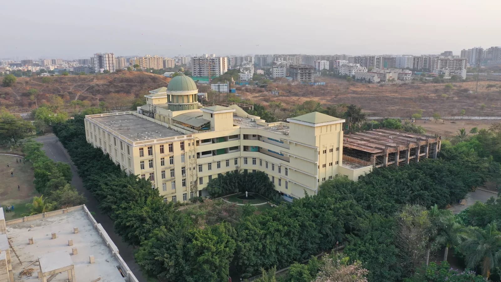 Aerial view of the ADYPU academic building at dusk, Pune