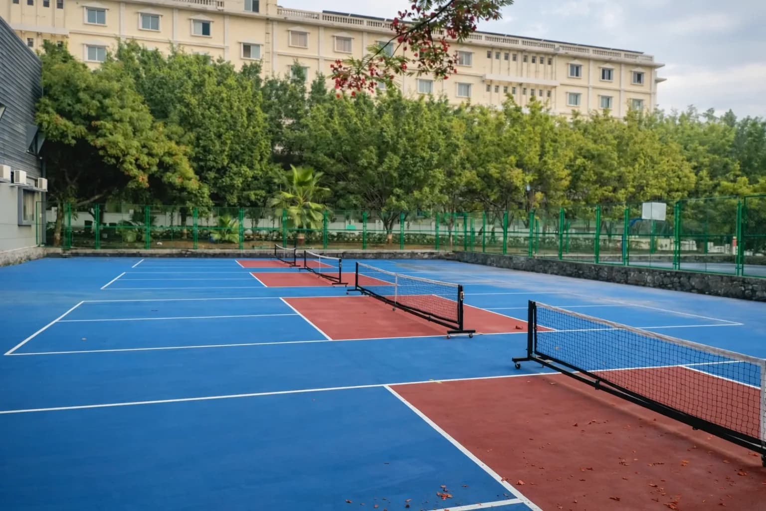 Outdoor sports courts and hostel building at ADYPU, Pune