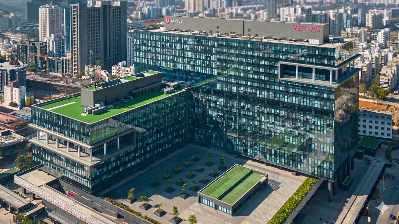 Aerial view of a glass office tower in Pune's business district