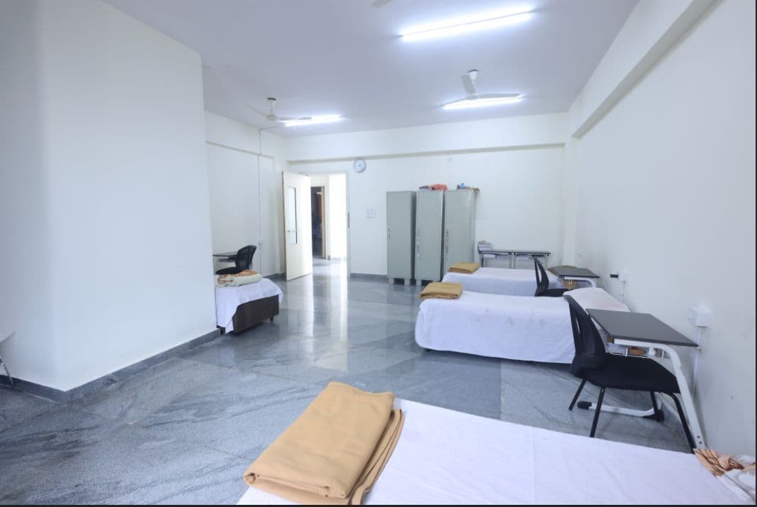 Girls hostel accommodation with beds and study area, Rathinam